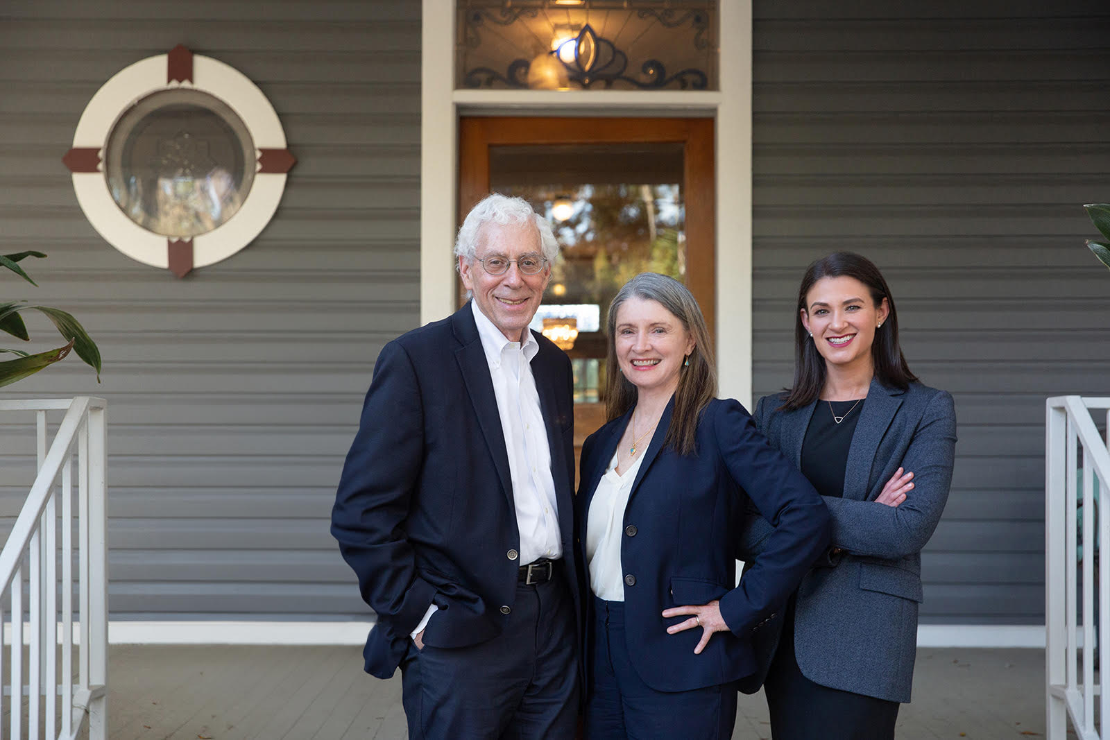 Jack, Cherie, and Julie Fine, three personal injury attorneys in Gainesville, Fl, standing in front of the FFP Law building.